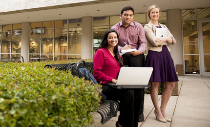 Three ɫ Neeley MBA students sit outside the business building