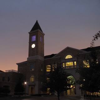 The clock tower at ɫ's Brown Lupton University Union glows at dusk